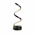Modern LED-bordslampa i svart med slingrande design och varm belysning.