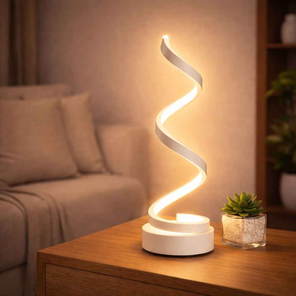 Bordslampa i vit modern design med slingrande LED-belysning på bord.