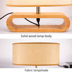 bordslampa i trä med oval bas och tygskärm i detaljbild som visar material och hög kvalitet i trä och textil