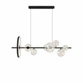 Svart taklampa med sju glaskupor i modern design, perfekt som belysning över matbord.